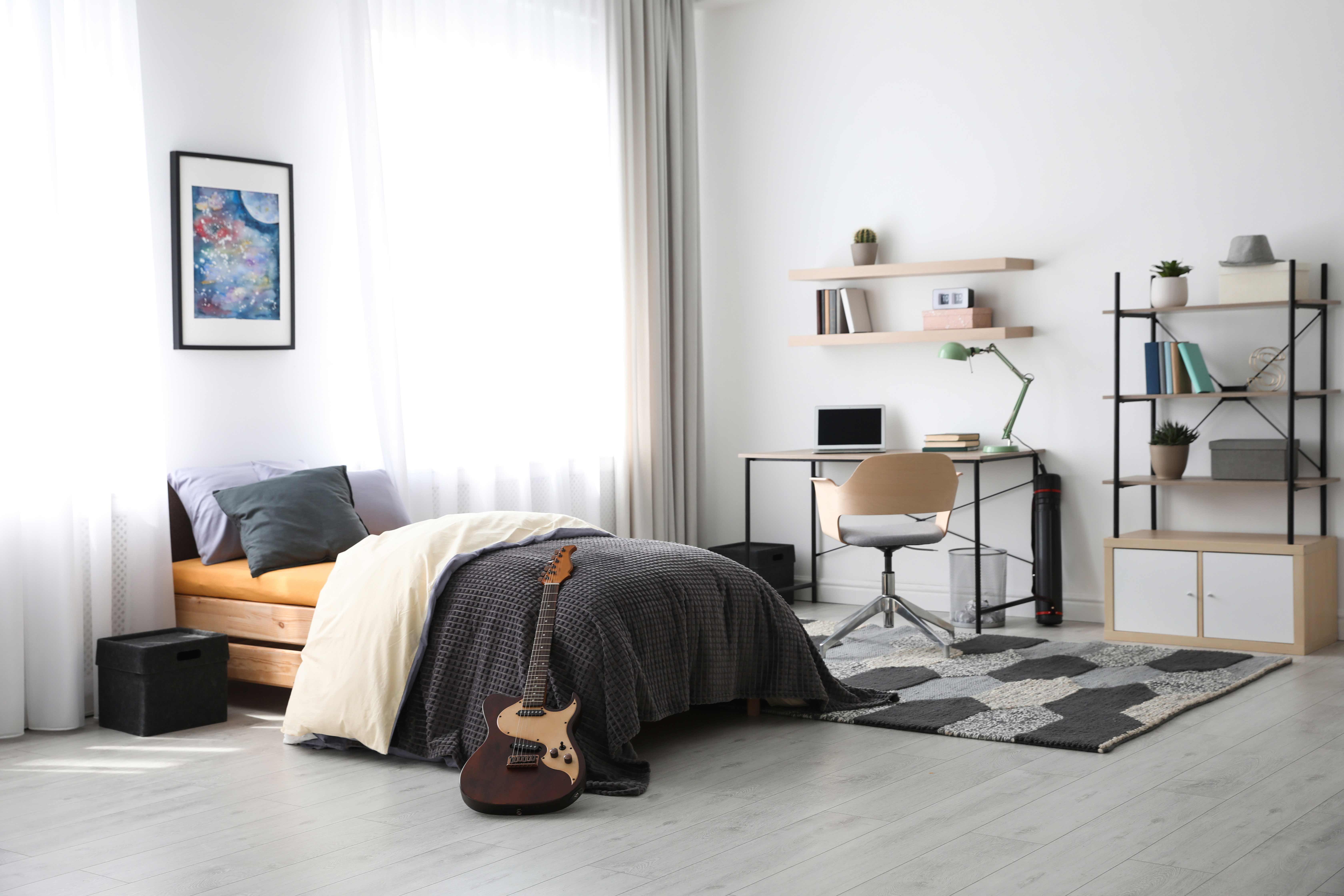 Modern teenager's room interior with writing desk and bed at the Flats at 15th, located a short drive away from Miami FL